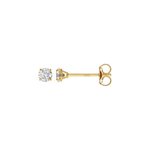 A pair of yellow gold stud earrings, one shown from the front with a round brilliant-cut clear gemstone and the other from the side showing the post and butterfly back, on a plain white background.
