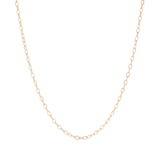 A delicate yellow gold filled cable chain on  a white background