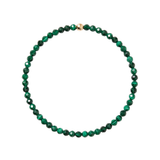 A beaded necklace made of faceted green malachite beads with a small gold accent bead at the top, shown on a plain white background.