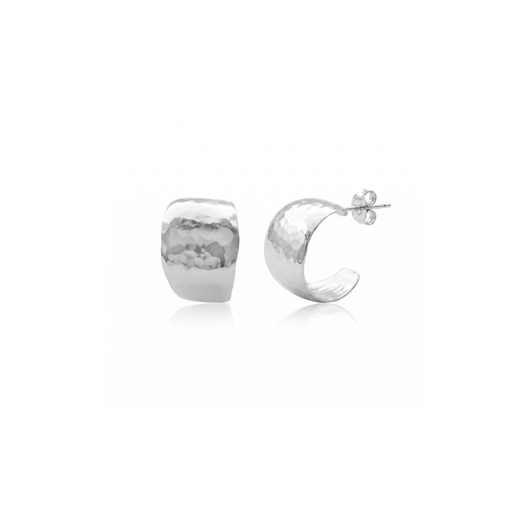 Two pearl stud earrings on a light gray background, one black pearl and one cream pearl with a gold post visible.