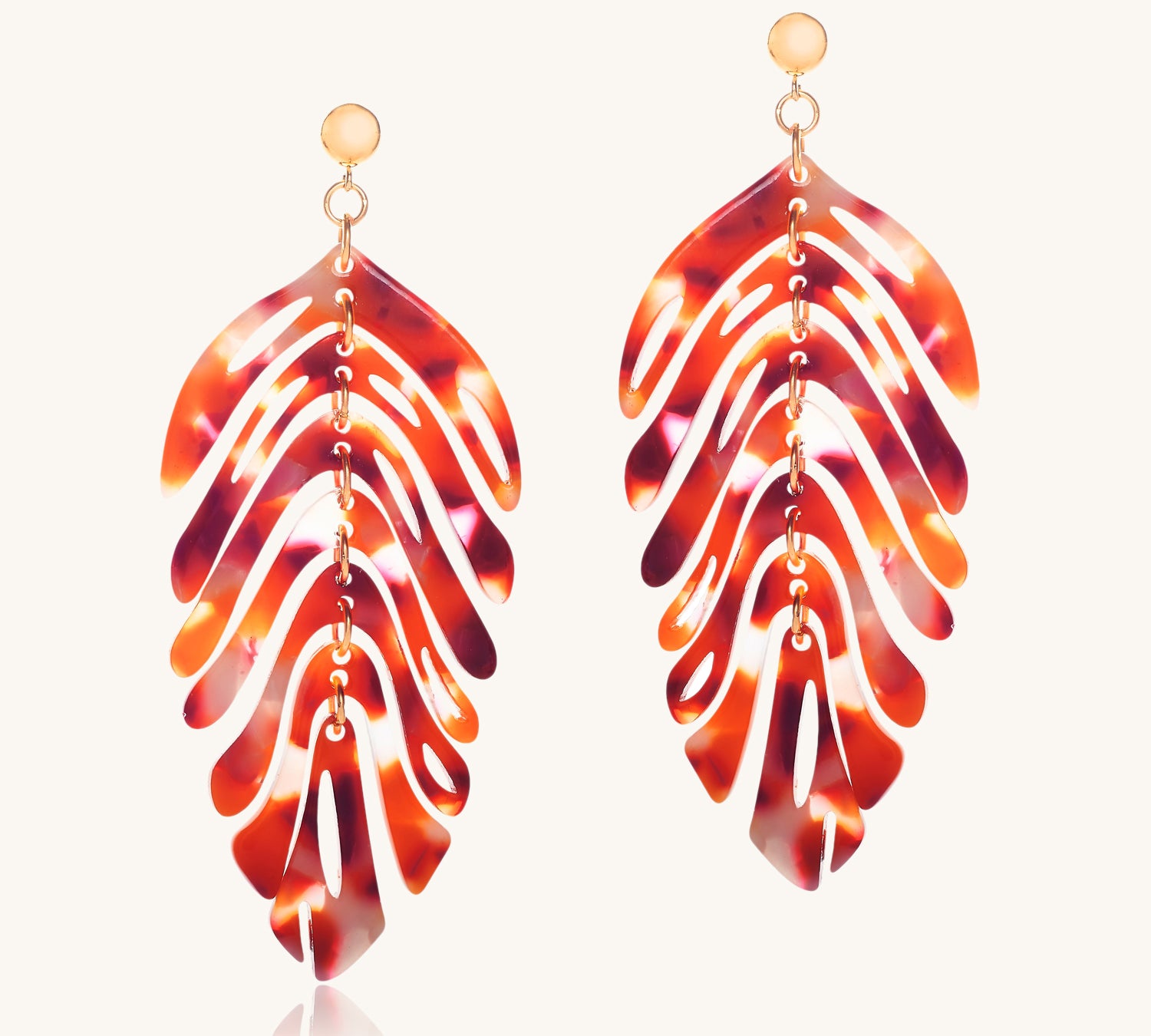 Tortoiseshell leaf-shaped earrings on a white background