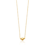 Gold filled ball beaded necklace on white background